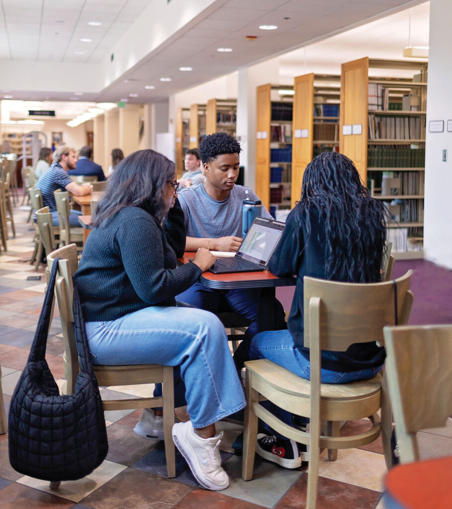 Students seated at library table