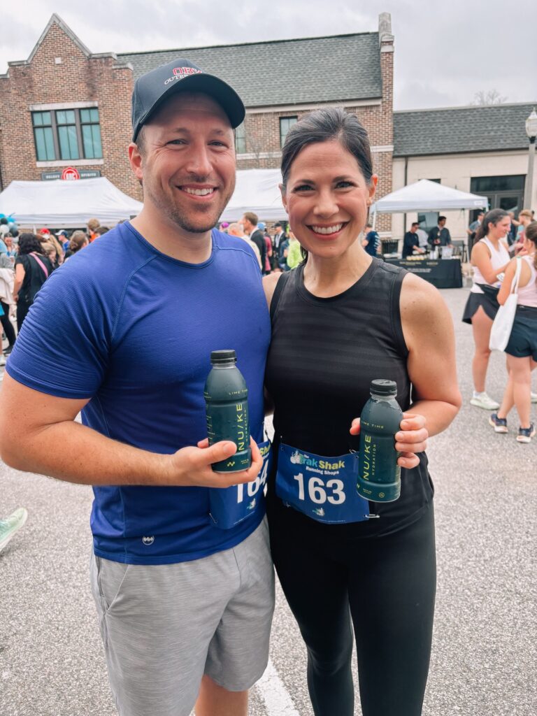Racers holding Nuke bottles