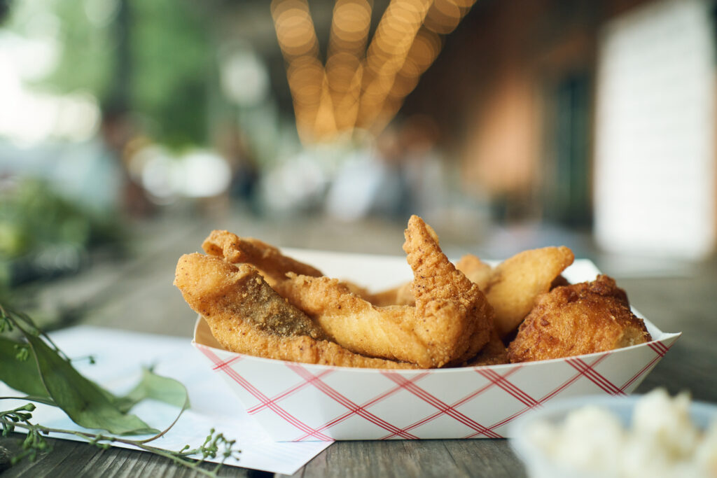 Fried catfish on table
