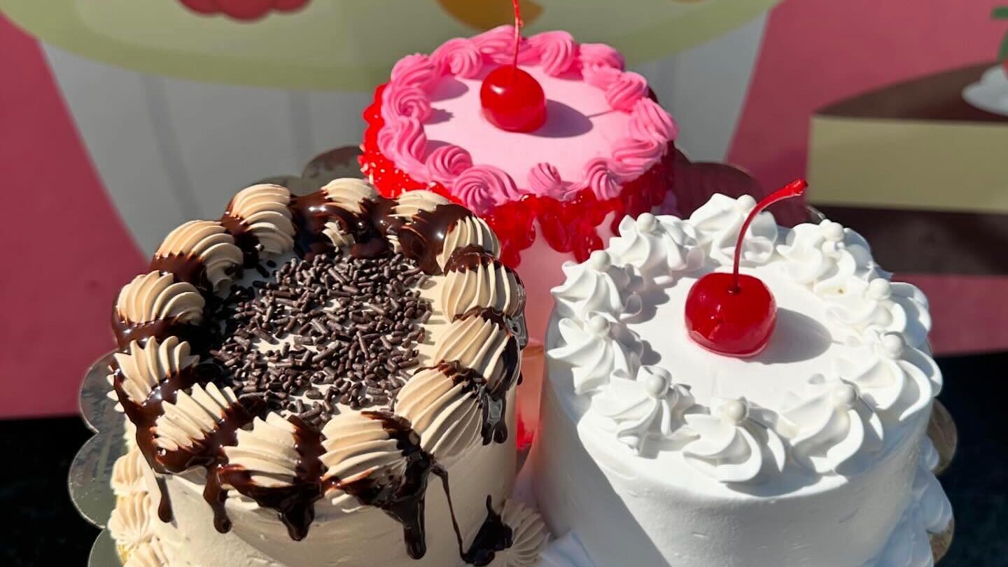 Cakes in front of dessert truck