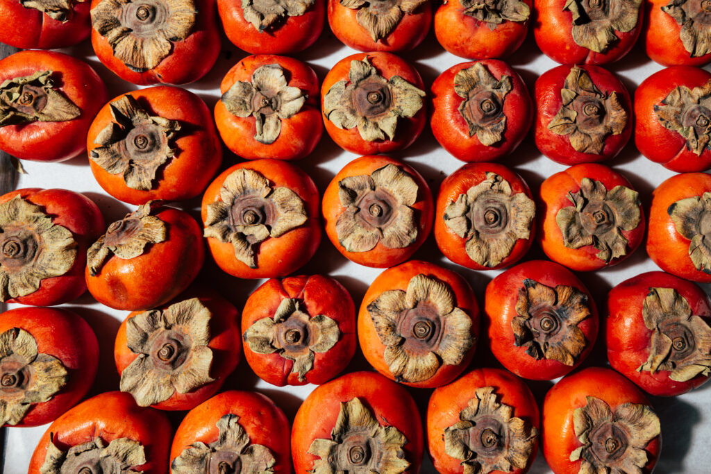 Persimmons on table